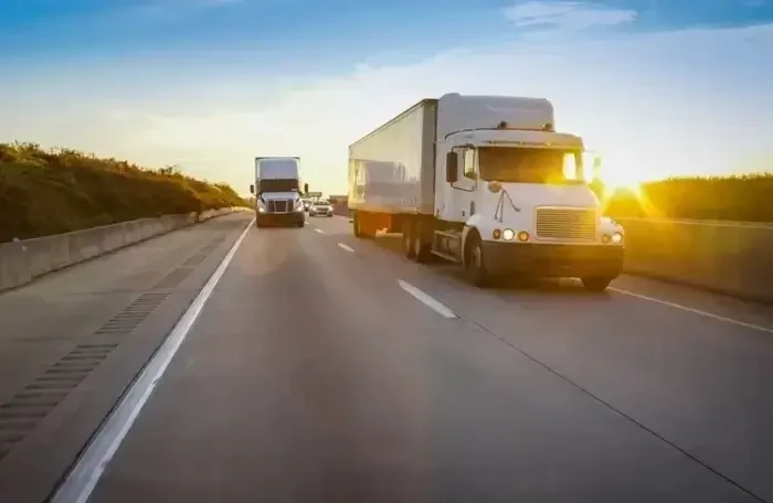  Semi truck on highway at sunse 